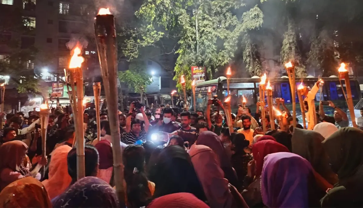 Seven college students hold torchlight procession demanding justice for rapist