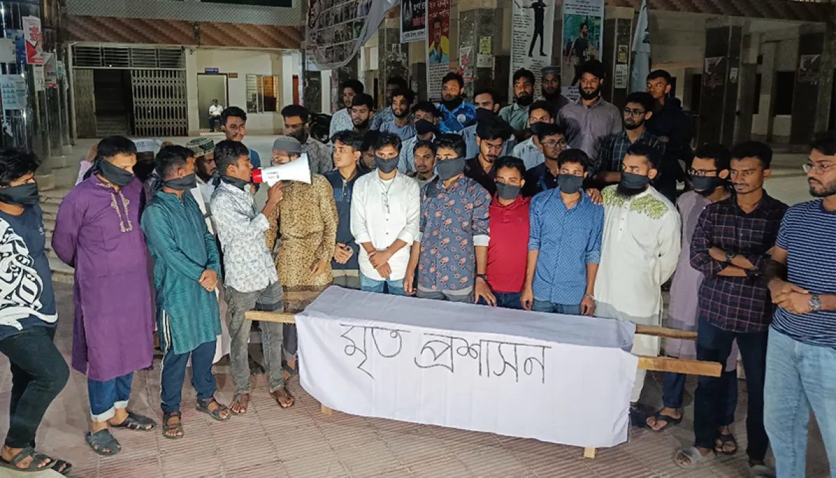 Students hold coffin procession calling the bu administration dead