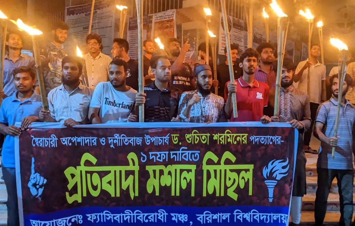 Students hold torchlight procession in movement to remove vc
