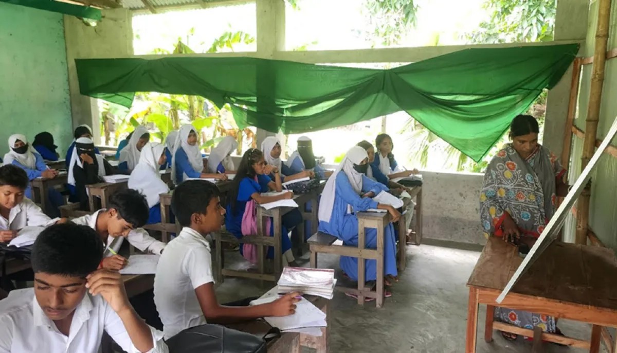 Madhyamik classes are held in a tin shed with curtains drawn