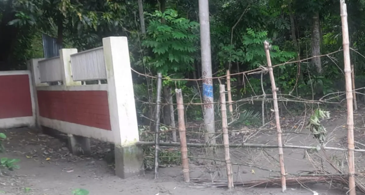 Bamboo fence at school entrance students protest